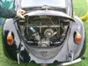 Rear of a black VW Beetle with the engine lid open