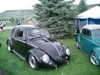 Black VW Beetle parked at a show