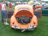Rear of an orange VW Beetle with the engine lid open